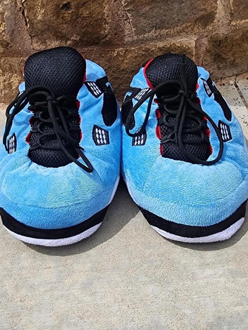 Air Jordan 4s Kids Light Blue Plush Lace-Up Sneakers with Black Accents